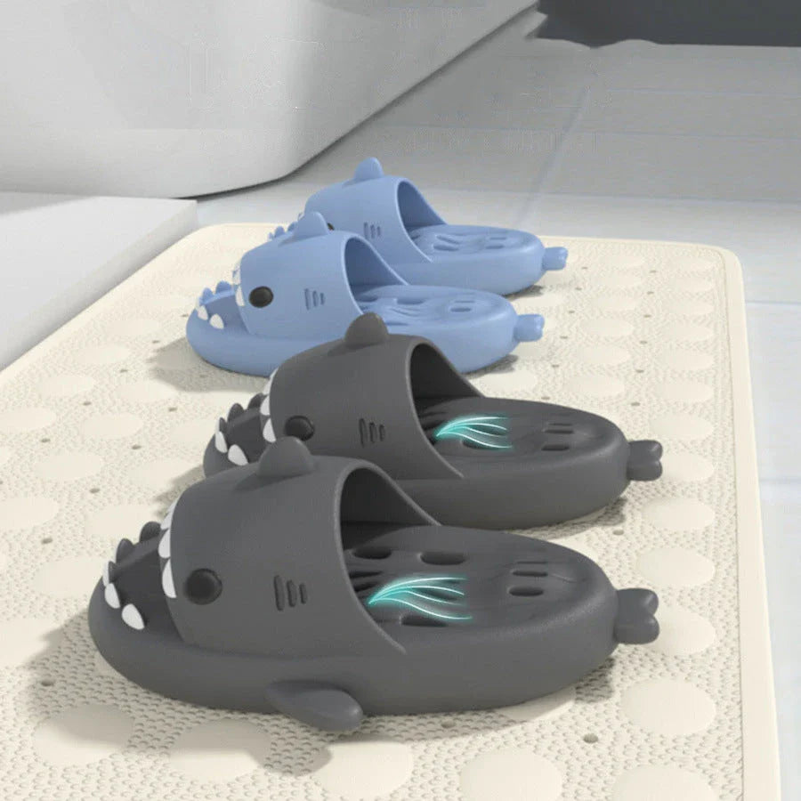 Colorful shark-themed shower slides with drainage holes, designed for comfortable and practical use in the pool or shower.