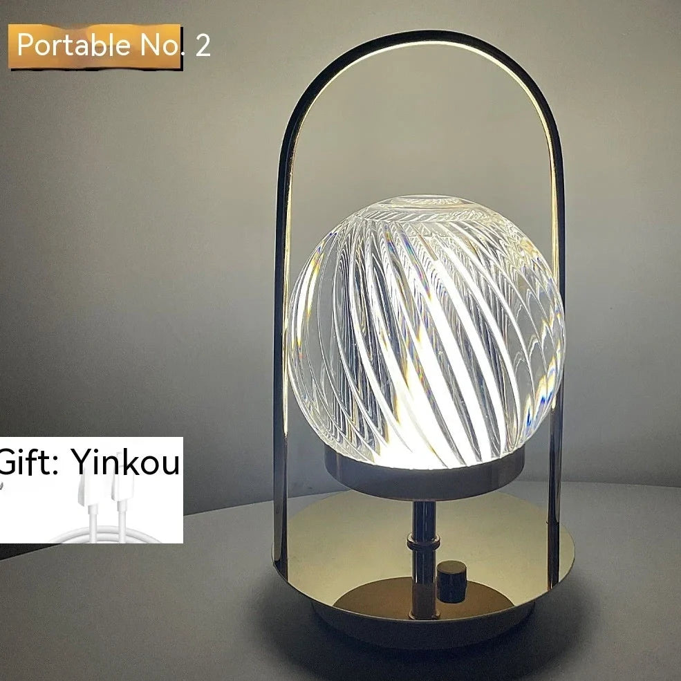 Metal portable ambience light with lantern shape measuring 11×23cm, showing touch controls and 27 colour options