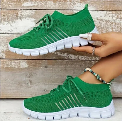 Women's lace-up platform sneaker in multiple colours with a low-top profile and rubber sole.