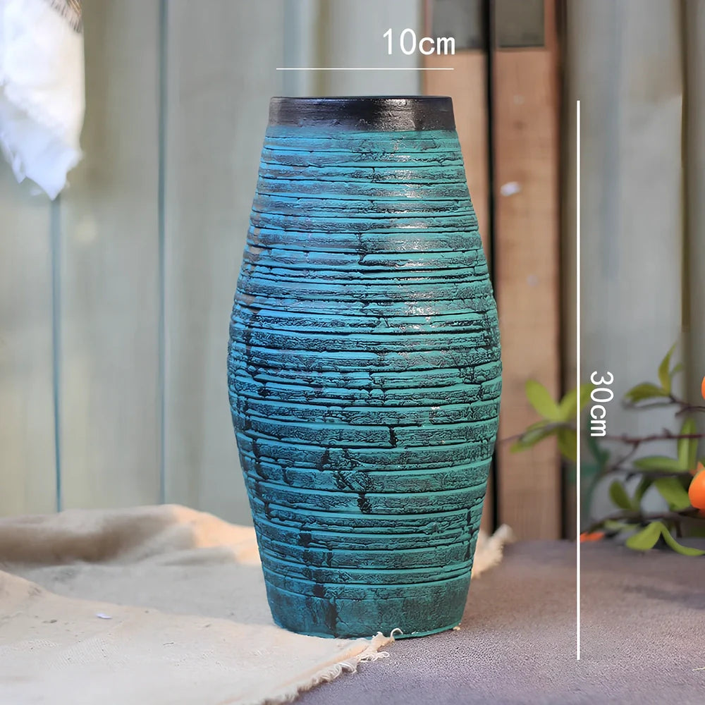 Ceramic mosaic vase with dried flowers, showing mosaic pattern and 25cm height