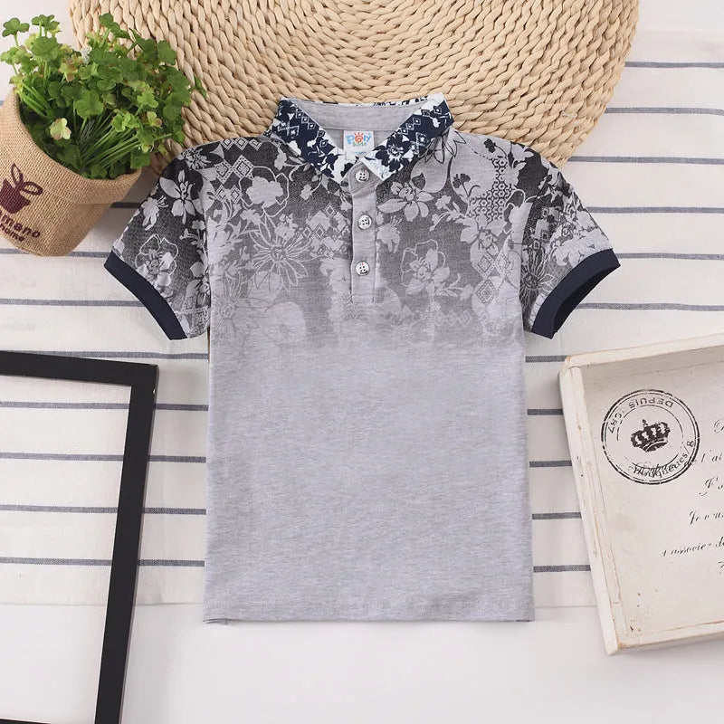 Boys short sleeve cotton lapel shirt in solid colour on a hanger.
