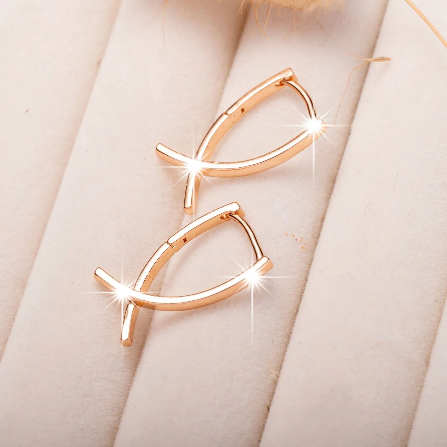 Cross-shaped copper earrings with rose gold finish, showing dimensions and post closure