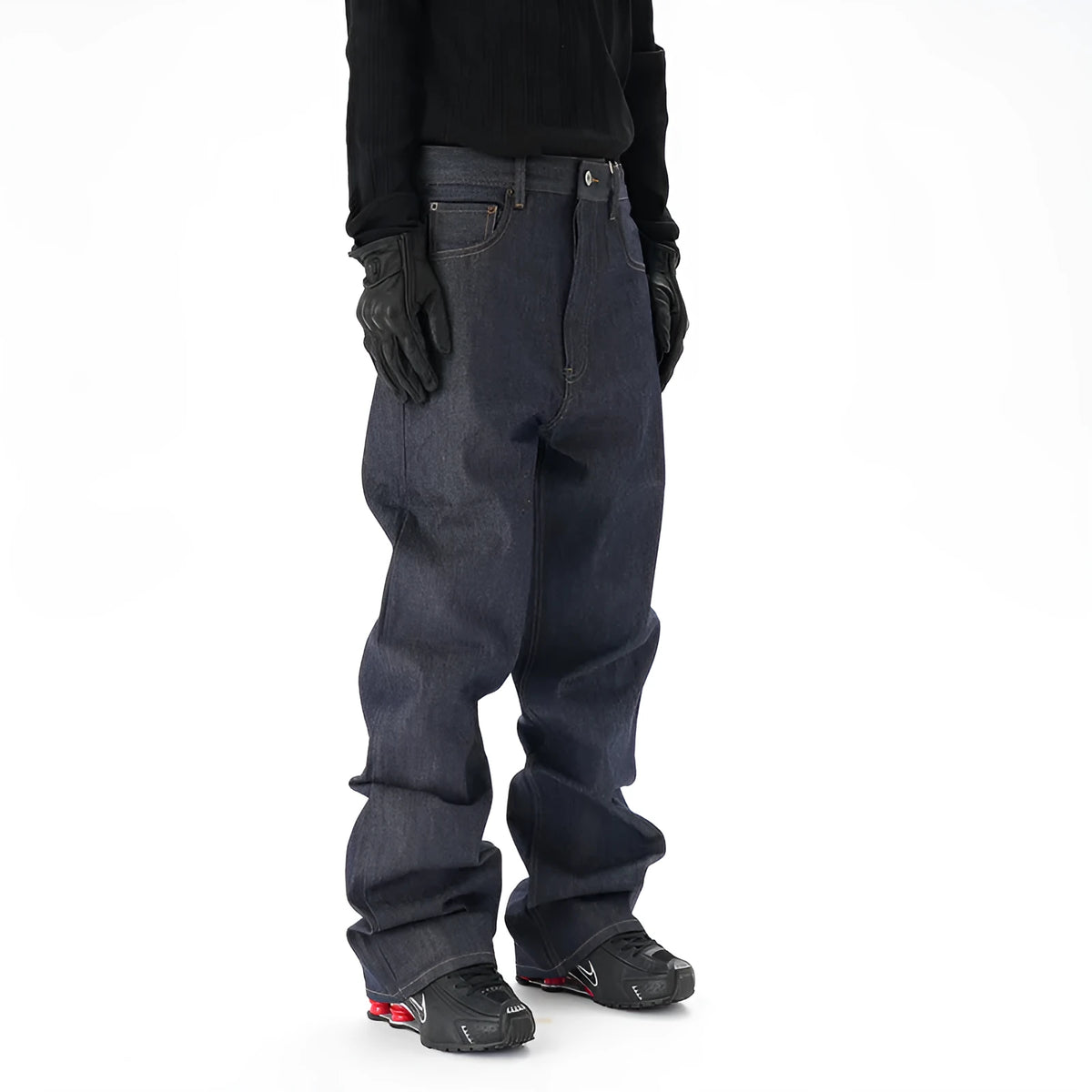 Man wearing dark blue loose-fit straight-leg denim jeans, showcasing the casual relaxed silhouette.