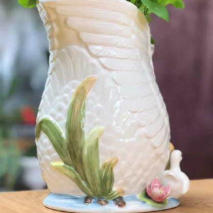 Ceramic vase with embossed swan design measuring 24.1cm length 15.2cm width 20cm height