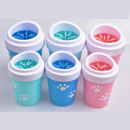 Silicone dog paw cleaner cup in blue, green, or pink with soft bristles for washing muddy paws