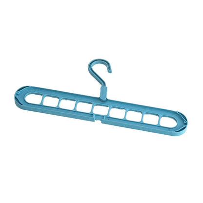 Green nine-hole folding hanger with trousers organised across nine hanging points, showing 45cm width