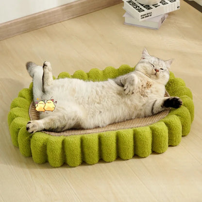 Green oval-shaped sisal cat scratching pad with a central bowl, serving as a cat bed and furniture protector.