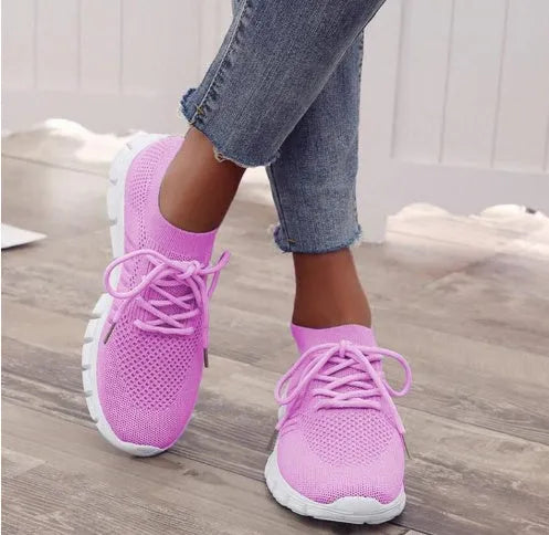 Women's lace-up platform sneaker in multiple colours with a low-top profile and rubber sole.