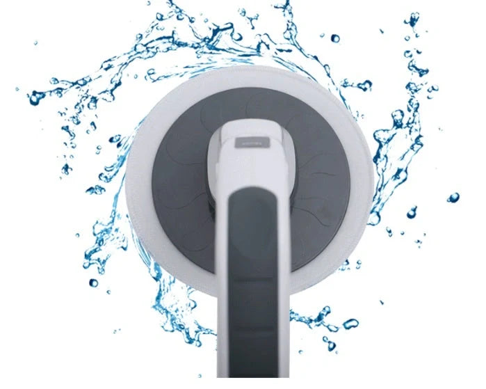 Wireless electric cleaning brush with mop heads, brush attachments, and charger on countertop