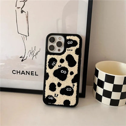Black plush fairy character back cover case for Apple iPhone mobile phone.
