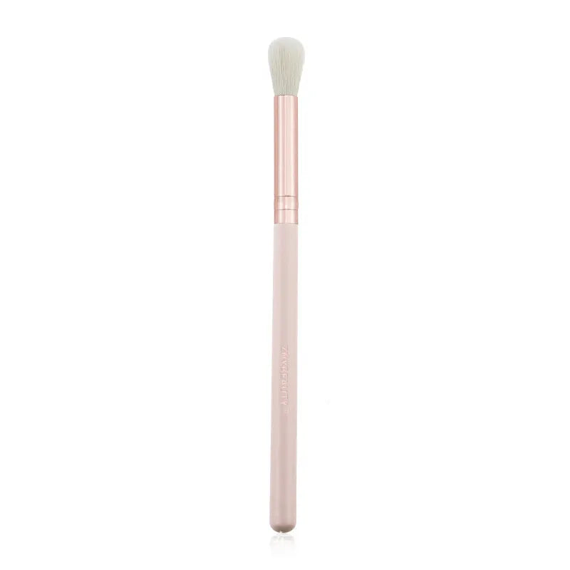 26 pink makeup brushes with wool bristles and wooden handles arranged in a PU zip bag.