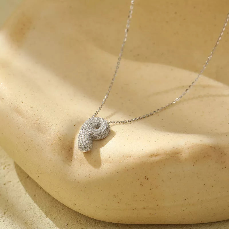 Stainless steel initial pendant necklace with zircon accents, personalized with your choice of letter.