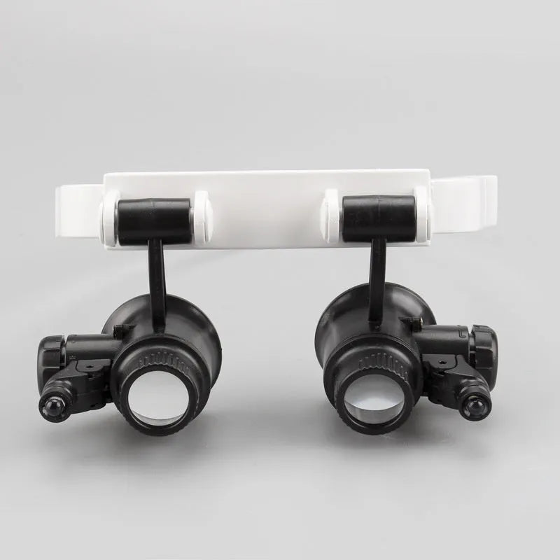White head-mounted magnifying glass with adjustable band, 30mm lenses, and foldable design for circuit board repair