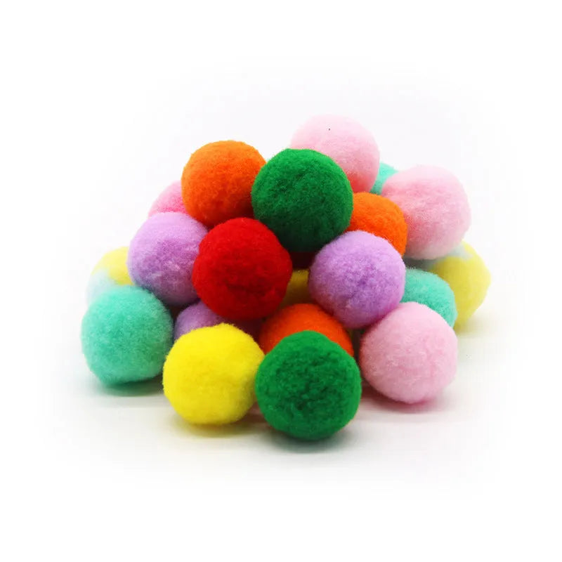 Interactive plastic pet toy gun and soft plush yarn balls on a carpet for fetch games.