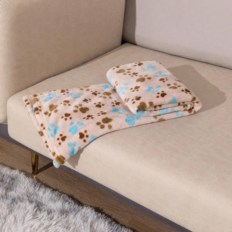 Blue dog cartoon print double-sided flannel pet blanket shown in a dog crate.