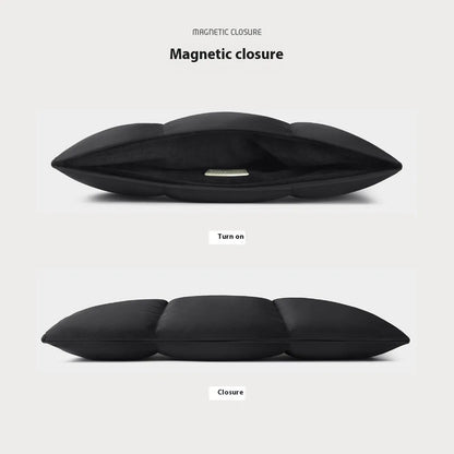 Soft black polyester laptop sleeve for a 15.6-inch laptop on a table.