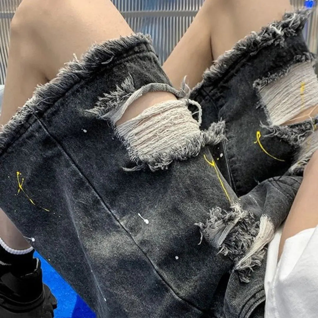 Men's loose-fit light blue denim shorts with a water-washed finish and fifth-pants length on a plain background.
