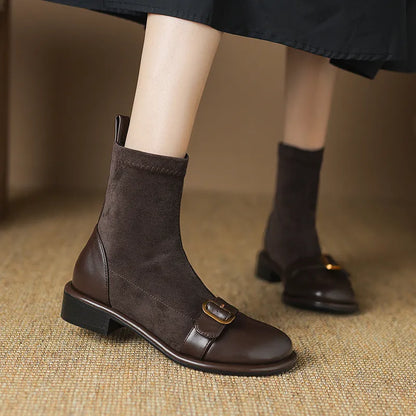 Women's black casual Martin boots with low heel, lace-up front, and decorative belt buckle stitching.