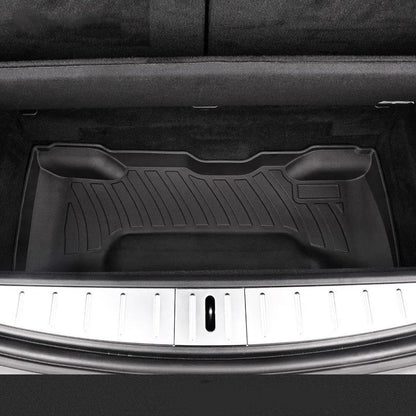 Black TPE rubber floor mats for Tesla Model 3, showing deep grooves and raised edges on driver's side.