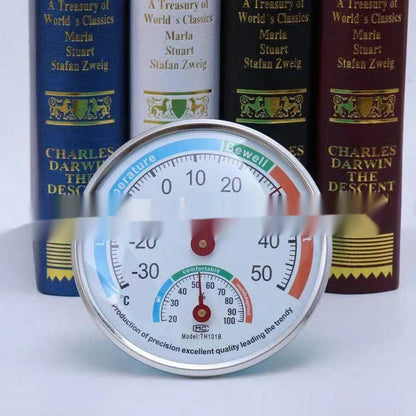 Indoor thermometer with black plastic pointer and red metal pointer on black or blue back shell