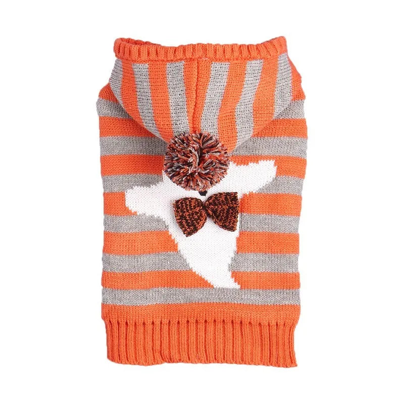Orange Halloween pet sweater with knitted stripes, fur ball accents, and hood for cats or dogs
