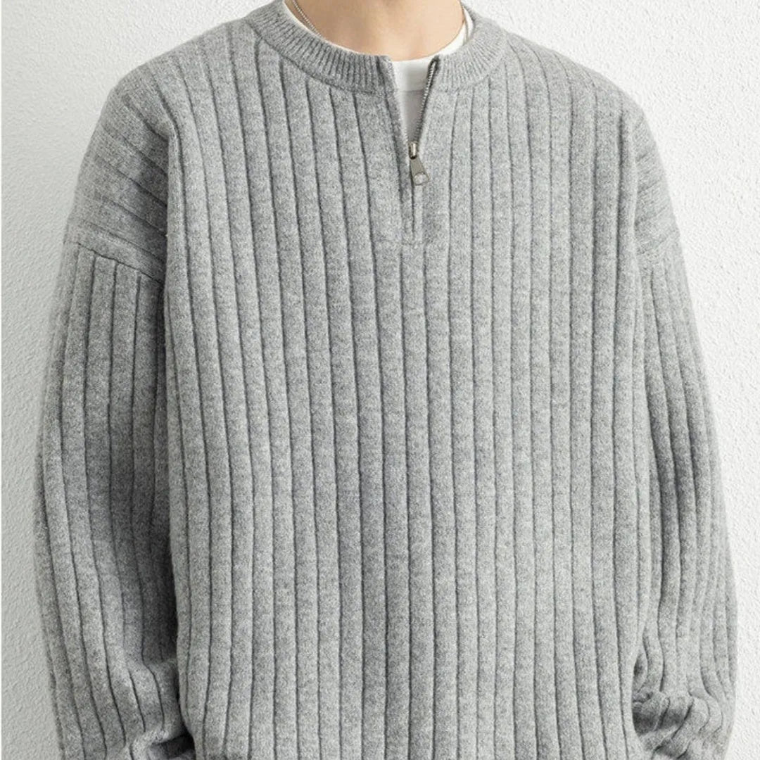 Men's grey half-zip pullover sweater with textured knit and loose fit, showing front view with zip partly open.