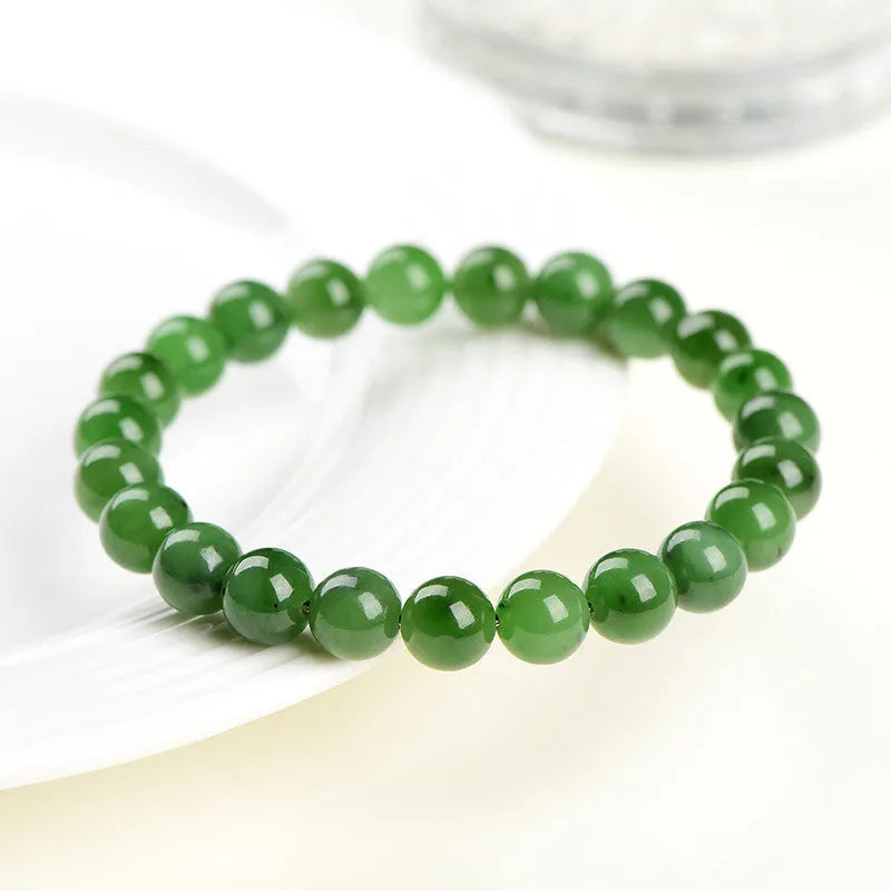 Natural jasper ball bracelet with polished Hetian jade beads in multiple sizes from 4mm to 12mm on wrist