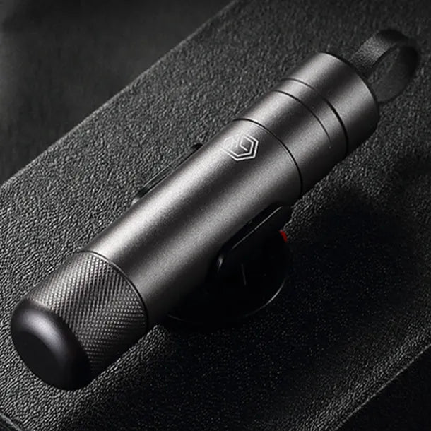 Gun grey aluminium car safety hammer with seatbelt cutter on a 3M rubber base, measuring 87mm long.