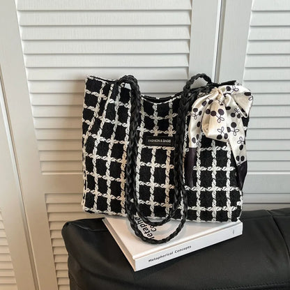 Horizontal square wool shoulder bag in black with sandwich pocket and internal organisation compartments