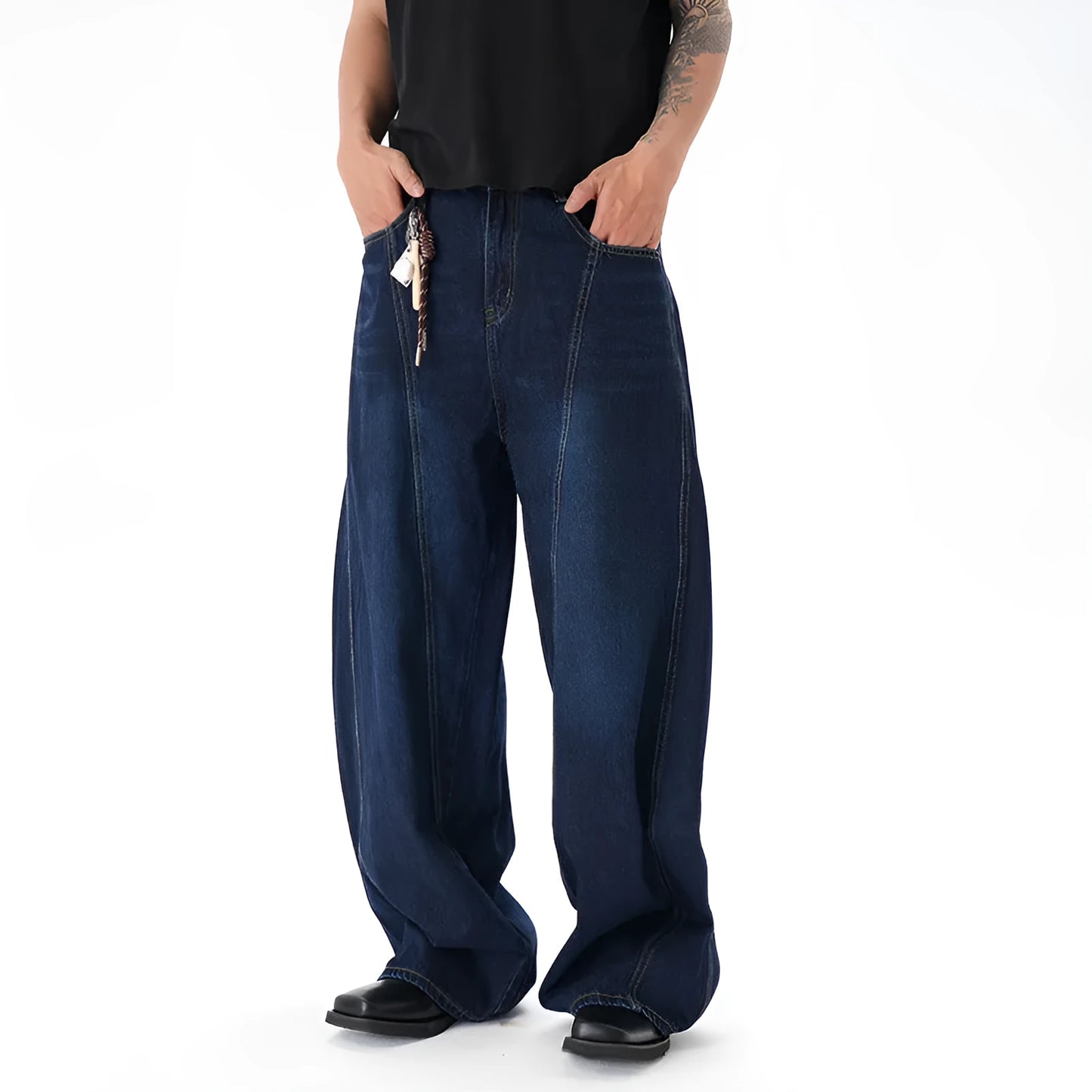 Woman wearing dark blue distressed wide leg denim jeans in a casual setting.