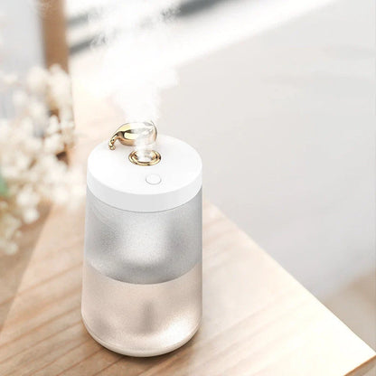 Columnar cat humidifier with electroplated finish and USB cable connection