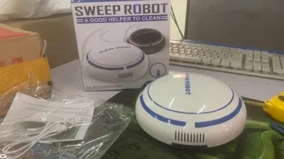 Mini desktop robot vacuum cleaner with 4 metre cord, flat nozzle, and dust box in white or black