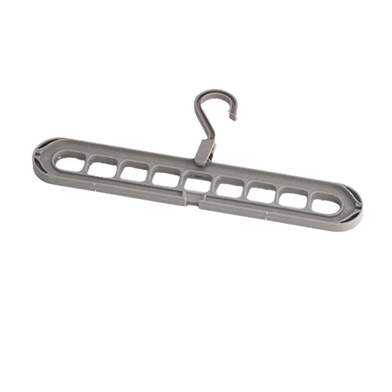 Green nine-hole folding hanger with trousers organised across nine hanging points, showing 45cm width