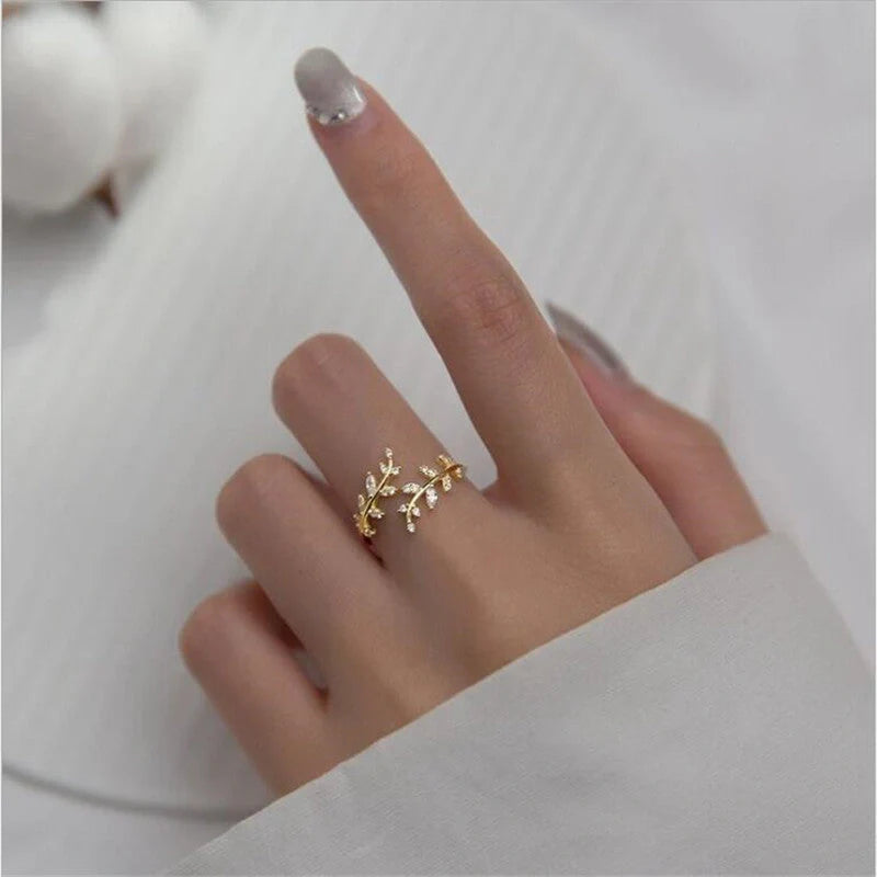 Women's fashion branch ring with leaf design in silver and gold finishes