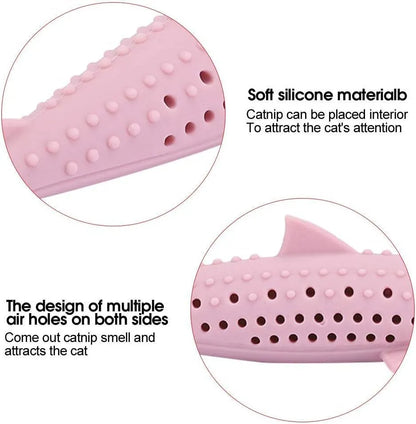 Green fish-shaped silicone cat chew toy with side holes, shown disassembled to reveal hollow interior for catnip.