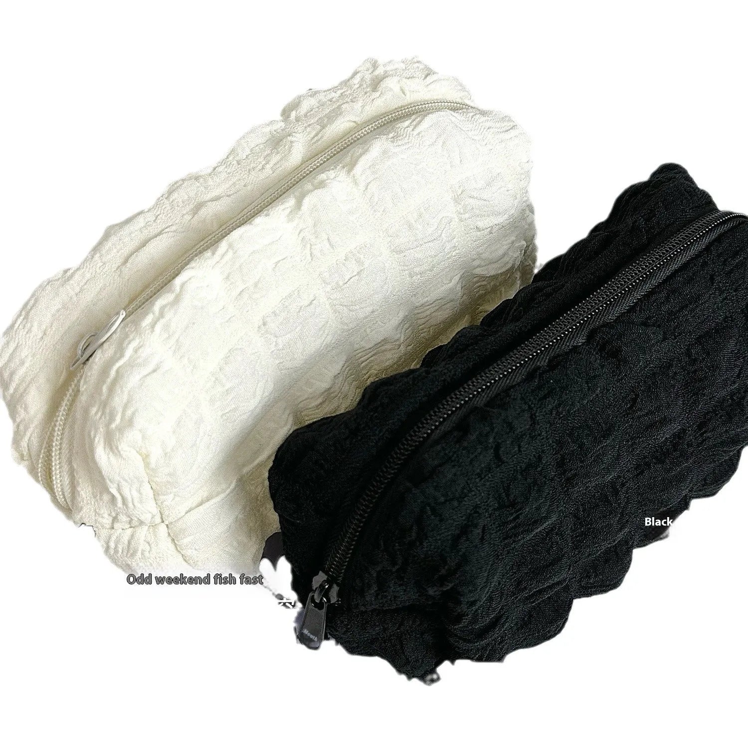 Beige and black fabric pencil case with padded cream puff design measuring 20cm length