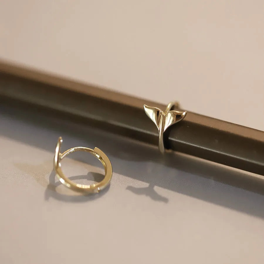 Pair of S925 sterling silver fishtail earrings with 14k gold plating in gold colour.