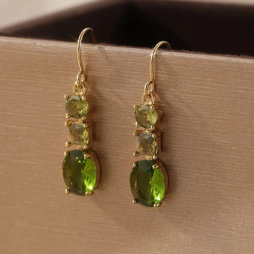 Green geometric copper earrings with a quadrilateral shape in a retro bohemian style