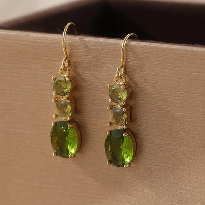Green geometric copper earrings with a quadrilateral shape in a retro bohemian style