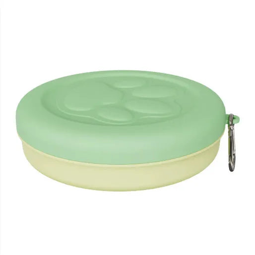 Collapsible silicone dog bowl with integrated snack compartment in light pink colour