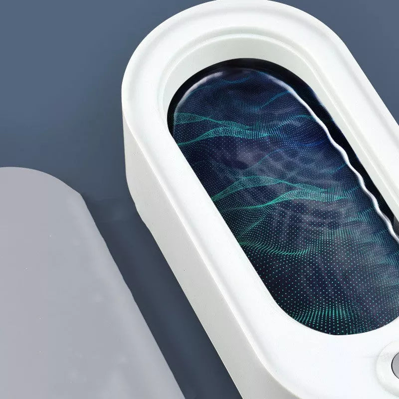 USB-powered glasses and watch cleaning device in dark green, pink, or white