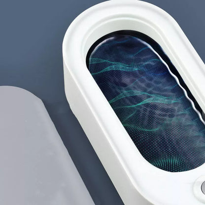 USB-powered glasses and watch cleaning device in dark green, pink, or white