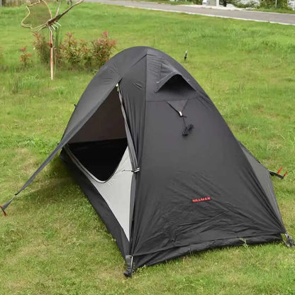 Single person tent with aluminium poles, silicon coating, and double-layer design in black colour, set up outdoors