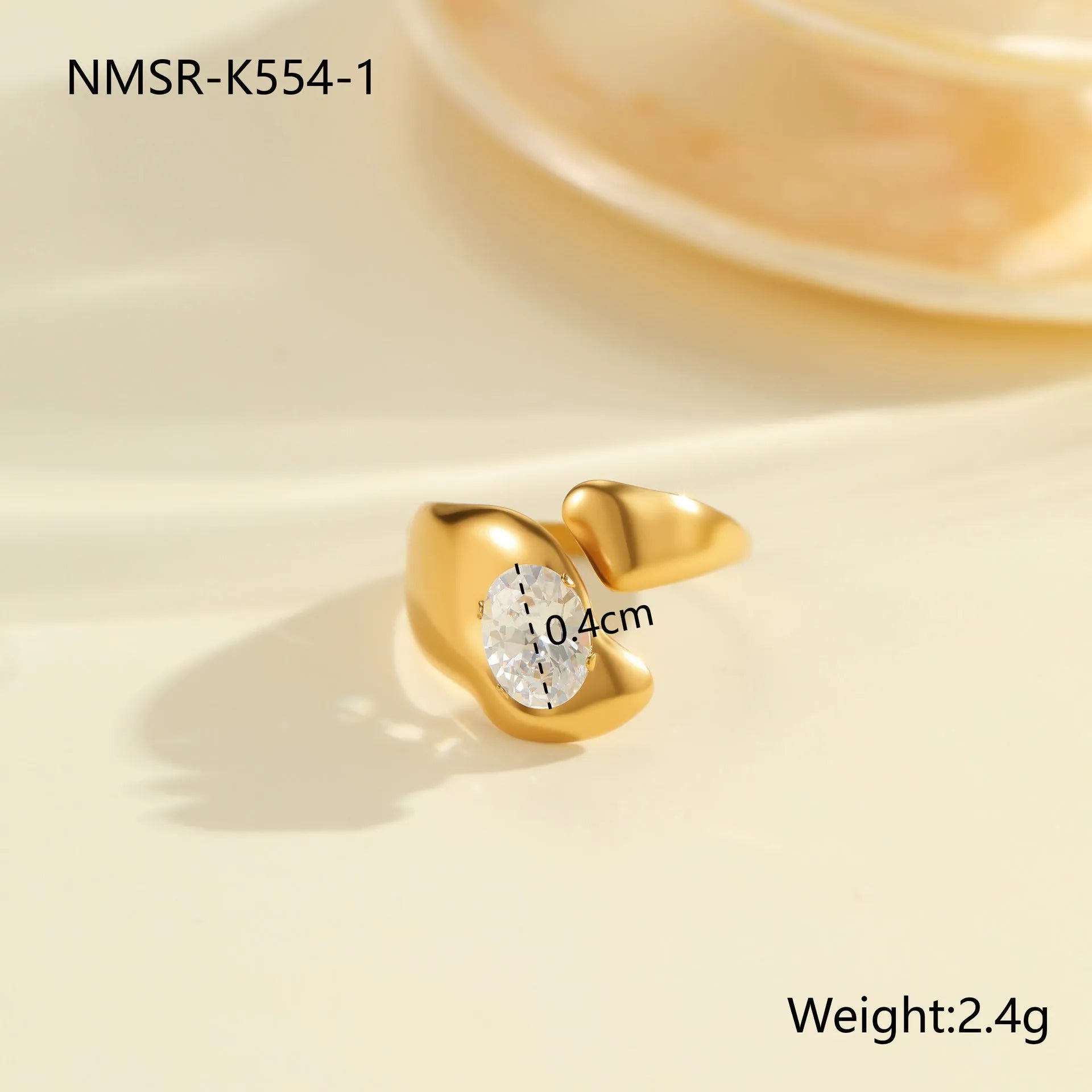 Geometric zircon ring showing round, oval and quadrangular design elements in stainless steel with electroplated finish