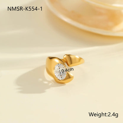 Geometric zircon ring showing round, oval and quadrangular design elements in stainless steel with electroplated finish