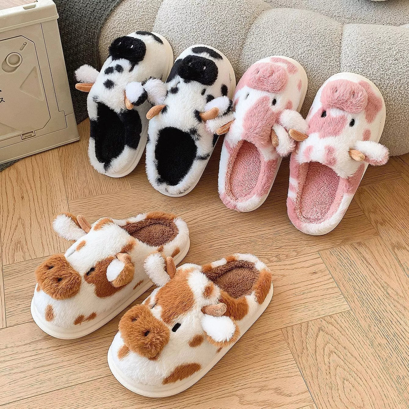 Cartoon cow plush slippers in black, leather red, and brown with non-slip soles