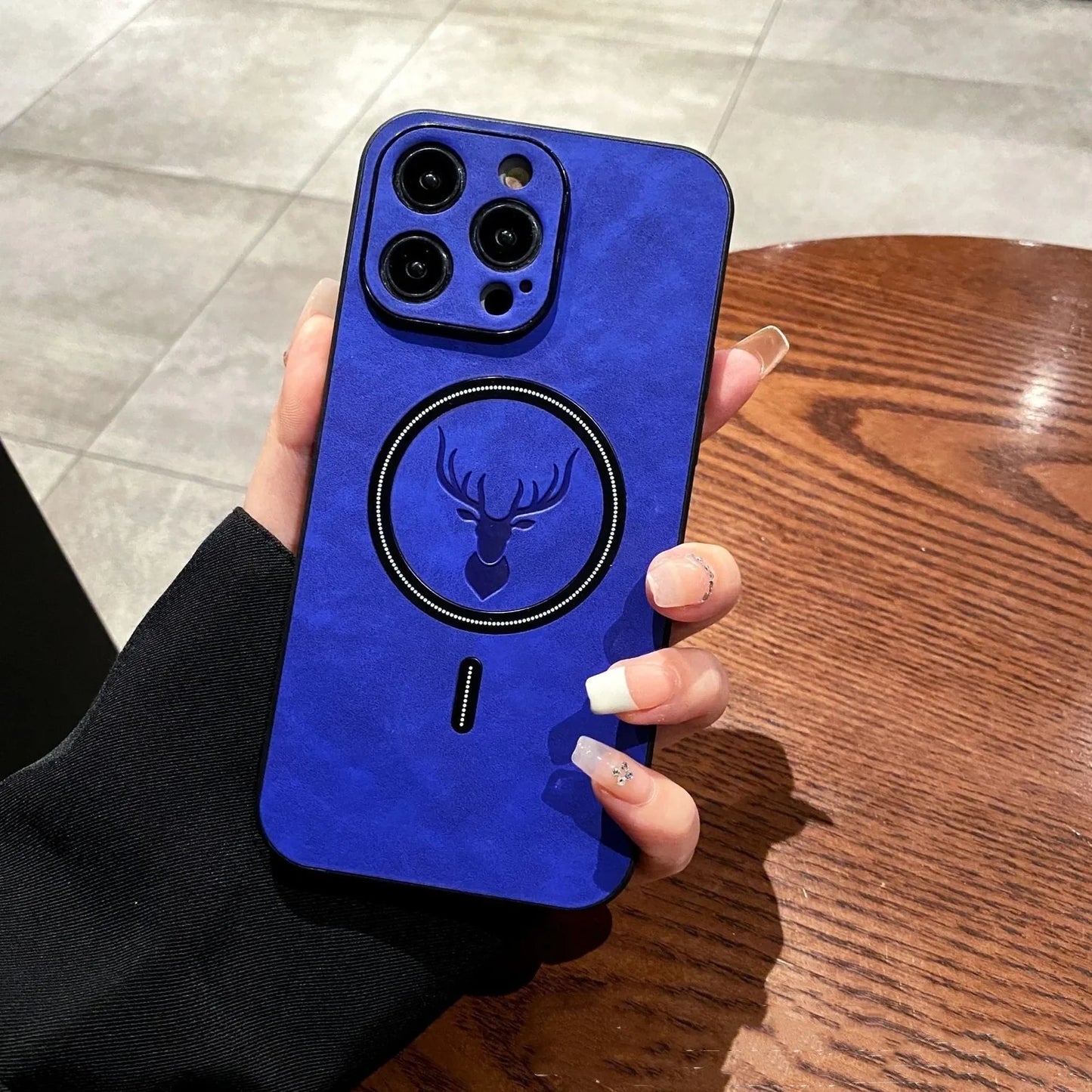 Elk magnetic suction phone case with cartoon design showing magnetic closure and imitation leather texture