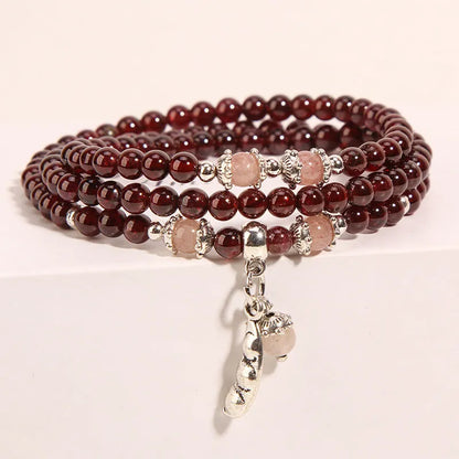 Wine red garnet crystal floral bracelet with Bohemian and ethnic design elements