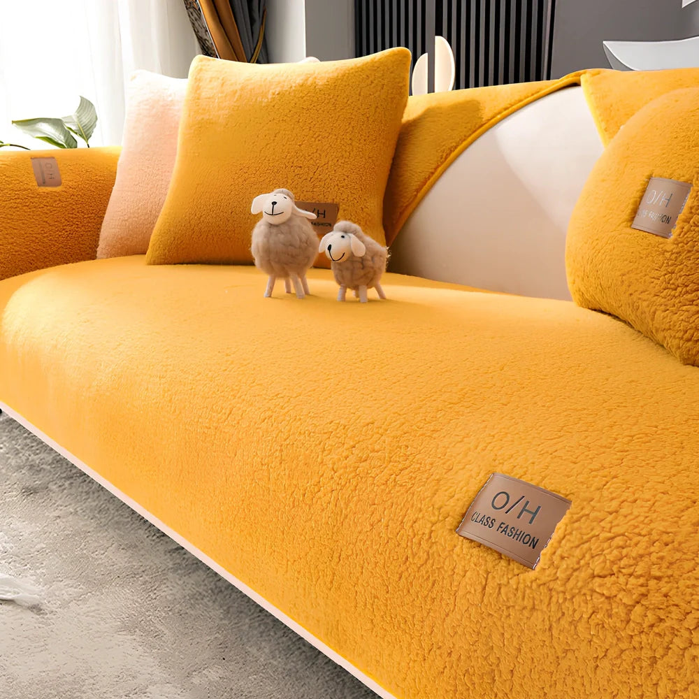 Lambswool sofa cushion with removable 45x45cm cover in solid beige colour on grey sofa