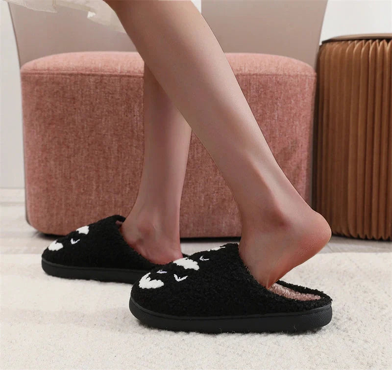 Halloween bat design plush slippers for indoor wear, available in white and black